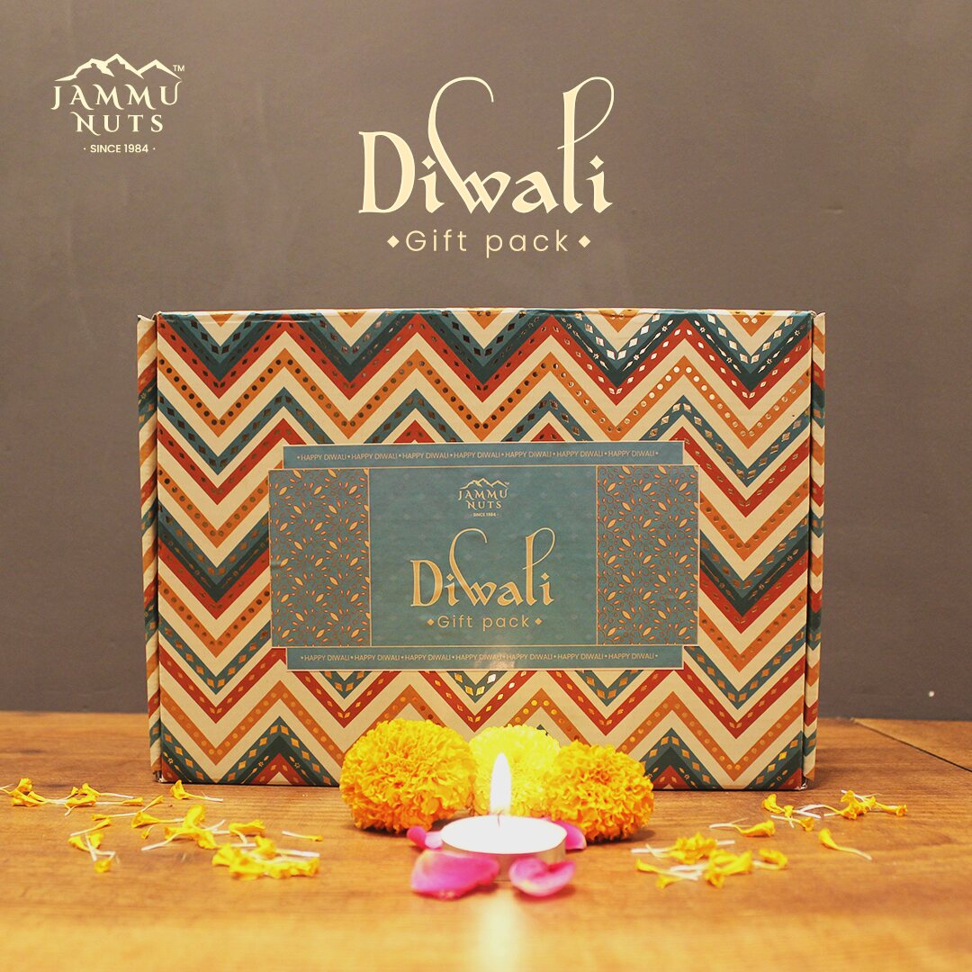 Jammu Nuts Diwali gift pack with decorative elements on a wooden surface