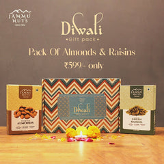 Jammu Nuts Diwali gift pack with almonds and raisins on a wooden surface.