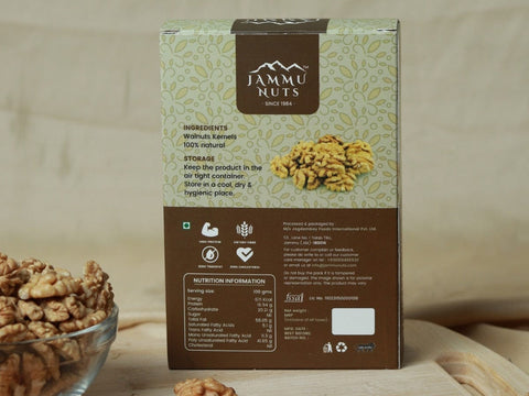 Jammu Nuts packaging with walnuts on a wooden surface