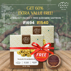 Jammu Nuts walnut packs with a free Kashmiri saffron offer on a wooden surface.